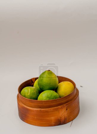 Photo for Lime on a mini bamboo basket - Royalty Free Image