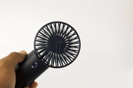 portable mini fan on plain background