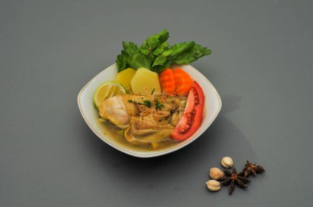 Photo for Chicken soup is a soup made from chicken, simmered in water, usually with various other ingredients - Royalty Free Image