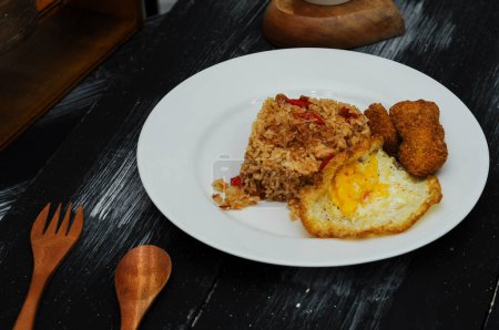 Photo for Fried rice with nugget and fried egg on white plate - Royalty Free Image