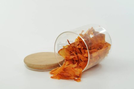 Photo for Dried orange root in a glass jar. - Royalty Free Image