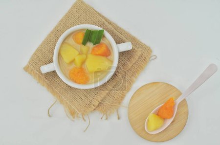 Photo for Breadfruit and sweet potato compote in a white bowl, a typical food suitable for breaking the fast - Royalty Free Image