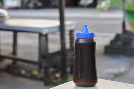 Photo for Blue color plastic bottle on the table - Royalty Free Image