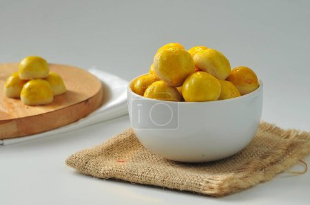 Photo for Nastar cake, also known as pineapple tarts, is a popular Indonesian pastry that is typically served during special occasions or as a snack with tea or coffee. - Royalty Free Image
