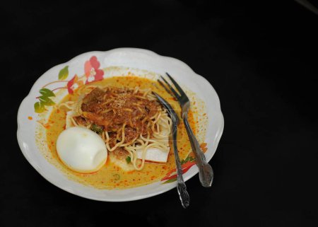 Lontong is a food made from rice wrapped in banana leaves and then boiled. This food is often considered another form of rice and can be paired with various side dishes