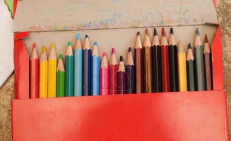 Photo for Colorful crayons on a notebook - Royalty Free Image