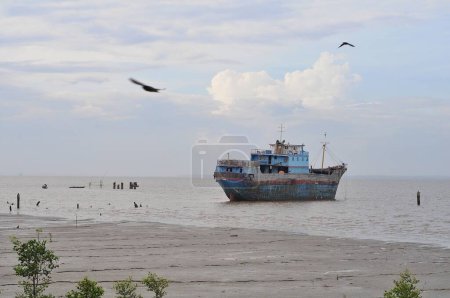 Photo for Ship on the beach with clouds in the morning - Royalty Free Image