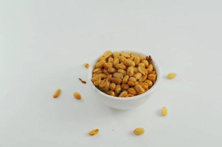 Photo for Fried onion peanuts in a white bowl, better known as tojin peanuts in Indonesia - Royalty Free Image