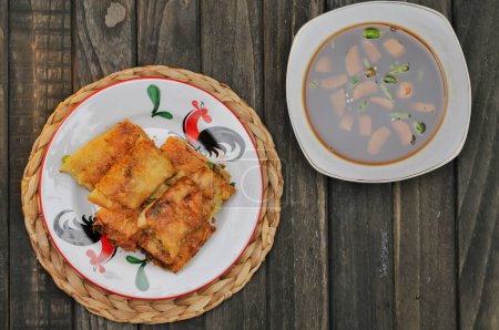 Martabak Mesir or Martabak Kubang is a snack made from flour dough containing eggs, seasoned meat, and leeks.perfect for recipe, article, catalogue, or any commercial usage, dark and moody