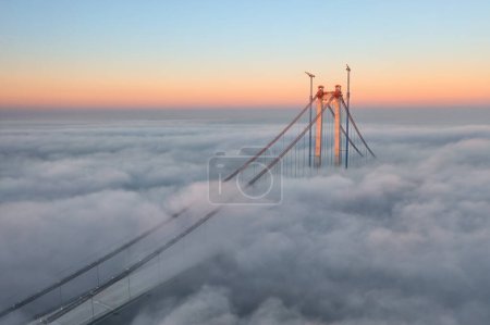 Photo for Panoramic aerial drone view from above of the suspended bridge over danube river, under construction, between Braila and Tulcea cities in Romania - Royalty Free Image