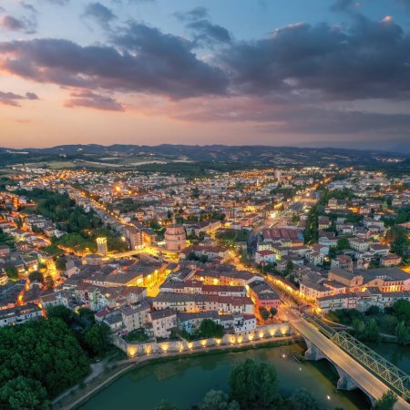 Téléchargez les photos : Old italian city Umbertide near Tevere river with cloudy sunset light. Aerial view from above - en image libre de droit