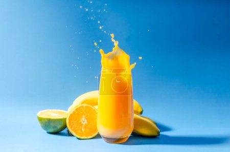 Photo for Orange Juice with Tropical Fruits for Breakfast. High quality photo - Royalty Free Image