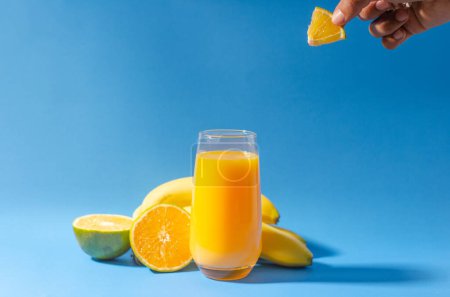 Orange juice with oranges on the side and bananas. High quality photo