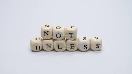Photo for Meditative, thoughtful wooden cubes with letters - Royalty Free Image