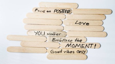 Photo for Motivational messages for wellbeing motivational quotes, handwriting moving forward quotes on popsicle stick - Royalty Free Image