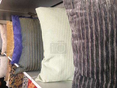 Photo for Luxury cushions Pillows arranged in rows for decorative purposes, visible luxury fabrics in stripes and different colors - Royalty Free Image