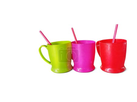 Photo for Colorful plastic drinking glasses and drinking straws on white b - Royalty Free Image