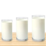 Three glasses of milk on wooden table isolated on white background