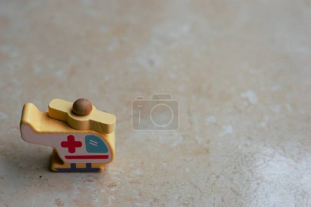 Photo for Helicopter ambulance toys, illustration of an emergency ambulance with copy space. Focus on the toys - Royalty Free Image