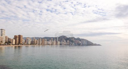 Benidorm,Alicante,Spain.Aerial photo from drone to Benidorm city skyline with beach and mountains in the background. December 6, 2022