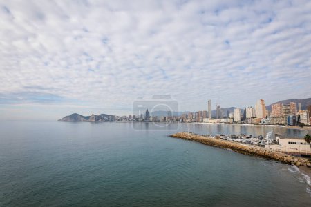 Benidorm,Alicante,Spain.Aerial photo from drone to Benidorm city skyline with beach and mountains in the background. December 6, 2022