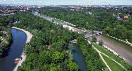The Isar river flows into the city of Munich aerial view