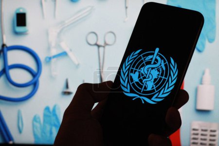 Photo for Indonesia - match 11th 2024: logo of the world health organization, WHO, with medical equipment background. - Royalty Free Image