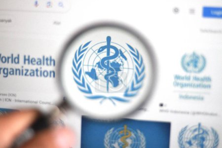 Photo for Indonesia-March 11 2024: WHO (World Health Organization) Logo under magnifying glass with selective focus. - Royalty Free Image