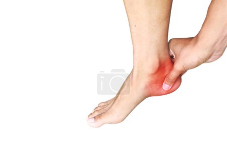Man experiences acute pain in the heel.the man held on to his heels.color photo with red dots isolated on White background. With copy space for text or anything for your health company. health concept