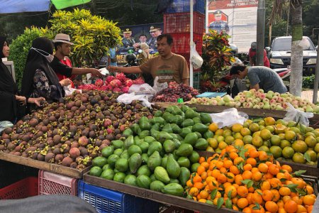 Photo for Bondowoso,Indonesia - January 07th,2024; Colorful fresh fruit market in traditional markets, oranges, avocados, mangosteens, grapes, apples. - Royalty Free Image