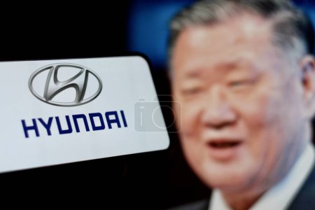 Photo for Indonesia - March 30th 2024: Hyundai logo is a multinational car company from South Korea with CEO Chung Mong Koo in background. - Royalty Free Image