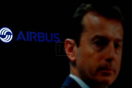 Photo for Indonesia - March 30th 2024:Airbus logo is displayed on smartphone screen with CEO Guillaume Faury in background. - Royalty Free Image