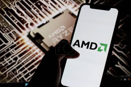 Photo for Indonesia - March 30th 2024: AMD logo is displayed on smartphone screen with chip AMD Ryzen in background. - Royalty Free Image