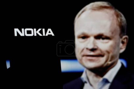 Photo for Indonesia - April 7th, 2024: Nokia logo is displayed on smartphone screen With CEO Pekka Lundmark in the background. - Royalty Free Image
