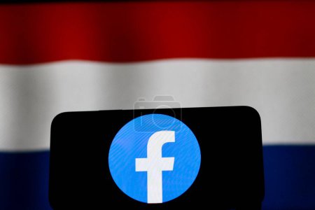 Foto de Indonesia-abril 23,2024: El logotipo de facebook, con la bandera de los Países Bajos en el fondo. - Imagen libre de derechos