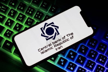 Photo for Indonesia-april 25th 2024: the logo of central bank of the Islamic Republic of Iran. Computer keyboard on background - Royalty Free Image