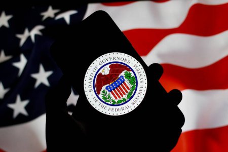 Photo for Logo of Federal Reserve System,The Fed,With america flag in The background. indonesia - april 30th 2024. - Royalty Free Image