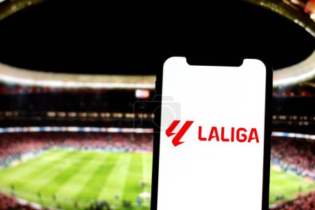 Photo for In this photo the logo of spanish football league LaLiga is displayed on a smartphone screen with Stadium on the background.Indonesia - May 18th 2024. - Royalty Free Image