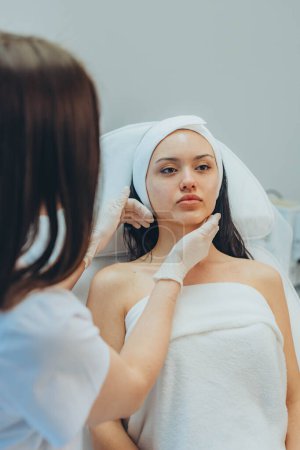 girl at a cosmetologists office doing skin cleansing. High quality photo