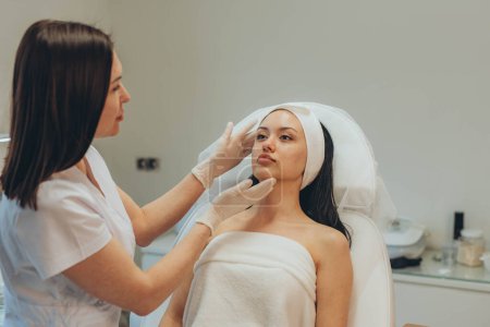 girl at a cosmetologists office doing skin cleansing. High quality photo