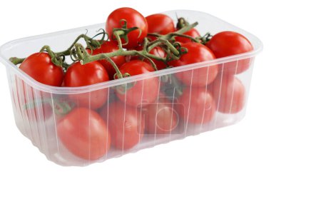 Photo for Plastic tray with red cherry tomatoes with sepals isolated on the white background. Tomato pile. Ripe and fresh organic vegetables harvested from local farmers. Clipping path. Top view. Copy space. - Royalty Free Image