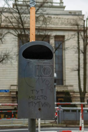 Photo for Berlin, Germany - March, 3rd, 2024. Garbage can with Anti Putin text on the day of demonstration in front of Russian Embassy on the President Election Day in Russian Federation. Noon against putin - Royalty Free Image