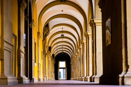 Photo for Low angle view of the Colonnade Archway of the Stiftung Juliusspital Hospital, Wurzburg, Franconia, Bayern, Germany. Baroque Walkway Arches Architecture Details. Sightseen Wallpaper. - Royalty Free Image