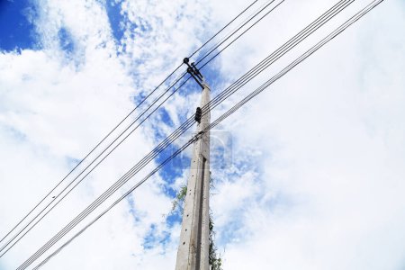 Photo for Electric pole with clouds and sky behind, Electricity post - Royalty Free Image
