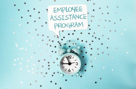 Photo for A clock with the words Employee Assistance Program written above it. The clock is on a blue background with a lot of stars - Royalty Free Image