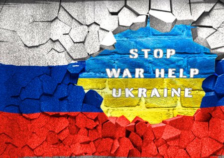 A flag with the words Stop War Help Ukraine written on it. The flag is torn and has a brick wall in the background
