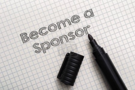A marker is on a piece of paper with the words Become a Sponsor written in marker
