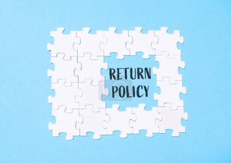 A puzzle with the word return policy written in the middle. The puzzle is made up of white pieces and is on a blue background