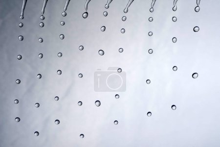 many water drops falling looking like rain or a shower in the bathroom