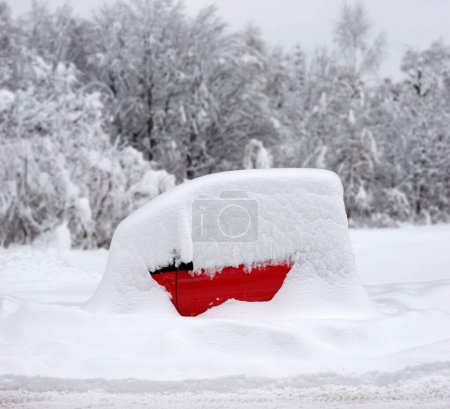 a red Smart, a tiny car, parked and completely covered in snow, winter, Munich, Bavaria, Germany